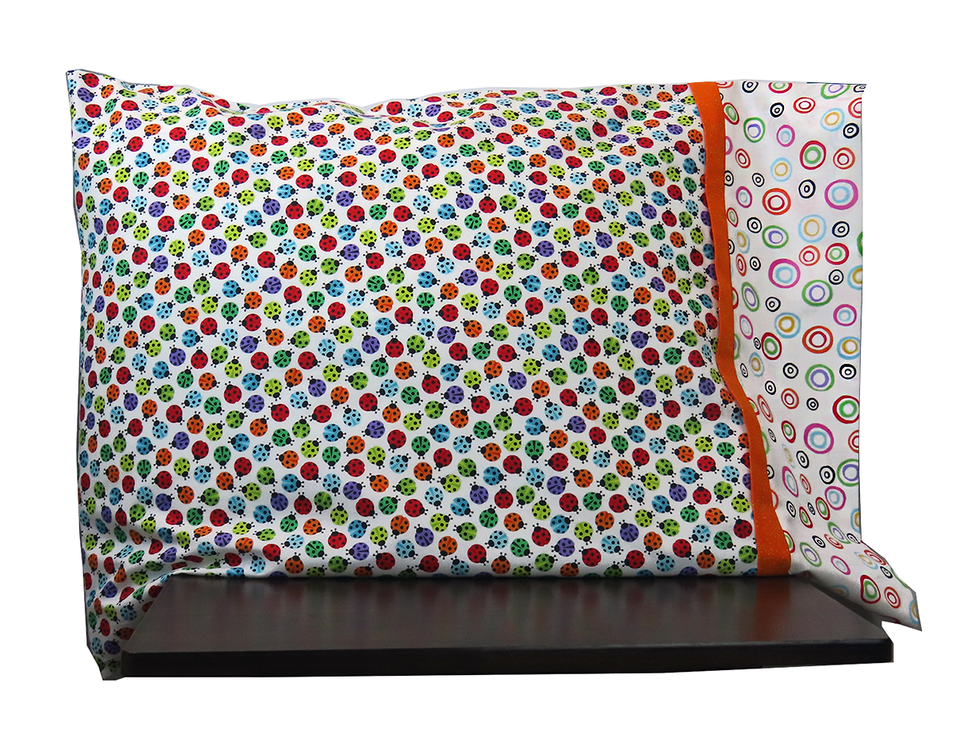 This pillowcase kit features multi-colored lady bugs!  So fun.  We've added a cuff with bright multi-colored circles and a bright orange flange to make this a very fun pillowcase. This pillowcase kit features multi-colored lady bugs!  So fun.  We've added a cuff with bright multi-colored circles and a bright orange flange to make this a very fun pillowcase.