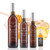 Four different size bottles of Mount Dora Olive Oil Company Honey Ginger White Balsamic Vinegar