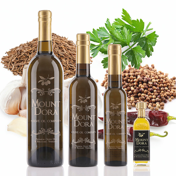 Four different size bottles of Mount Dora Harissa Fused Olive Oil