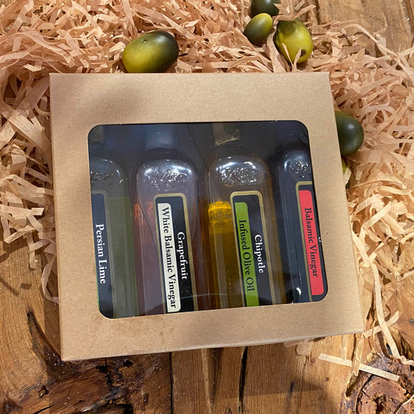 Pictured is a sample set of 4 small 2 ounce bottles in a craft window box.