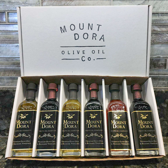 Pictured is our sample set of six 2 ounce bottles of flavored olive oils and balsamic.