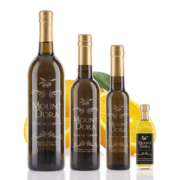 Four different size bottles of Mount Dora Sweet Valencia Orange Infused Olive Oil
