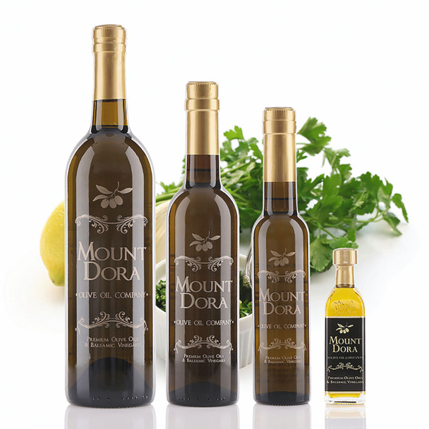 Four different size bottles of Mount Dora Milanese Gremolata Infused Olive Oil
