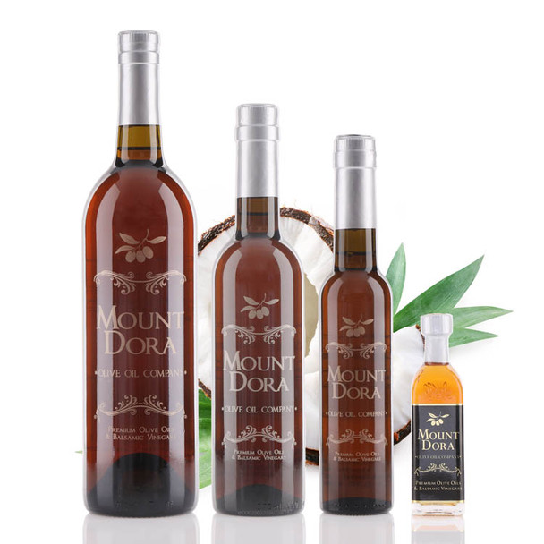 Four different size bottle of Mount Dora Olive Oil Company Coconut White Balsamic Vinegar
