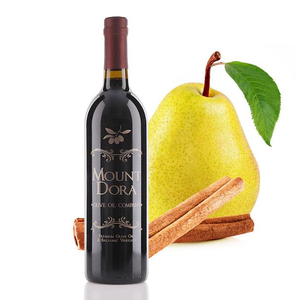 A 750mL bottle of Mount Dora Olive Oil Company Cinnamon Pear Dark Balsamic Vinegar