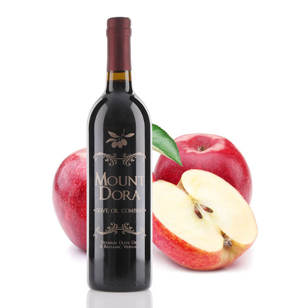 A 750mL bottle of Mount Dora Olive Oil Company Red Apple Dark Balsamic Vinegar