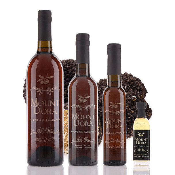 Four bottle sizes of Mount Dora Black Truffle Olive Oil with rich gold label and elegant packaging