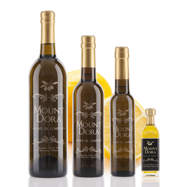 Four different size bottles of Mount Dora Eureka Lemon Infused Olive Oil