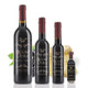 Four different size bottles of Mount Dora Olive Oil Company Blackberry Ginger Dark Balsamic Vinegar