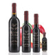 Four different size bottles of Mount Dora Olive Oil Company Red Apple Dark Balsamic Vinegar