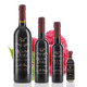 Four different size bottles of Mount Dora Olive Oil Company Raspberry Dark Balsamic Vinegar.