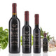 Four different size bottles of Mount Dora Olive Oil Company's Neapolitan Herb Dark Balsamic Vinegar.