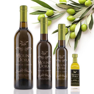 Four different size bottles of Mount Dora California Arbequina Extra Virgin Olive Oil