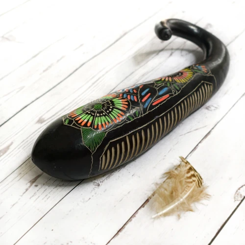 handcarved guiro shaker made in gourd for meditation