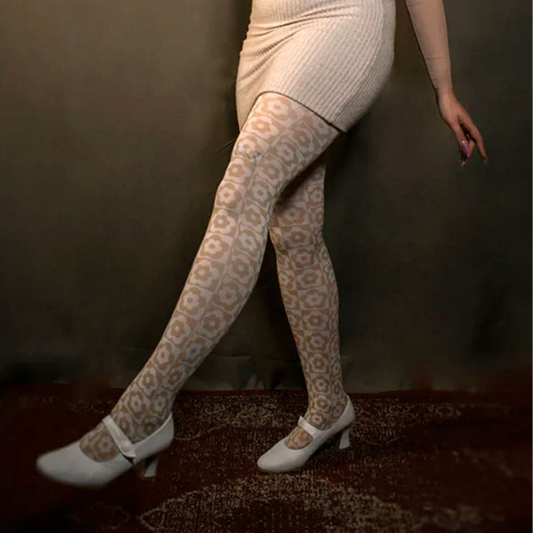 Woman wears Pamela Mann Retro 60 Mod Floral Flower Checkerboard Printed Tights