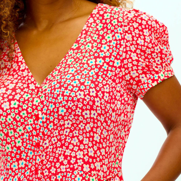 Sugarhill Brighton Retro 70s Kalisha Jumpsuit in red Rainbow Daisies
