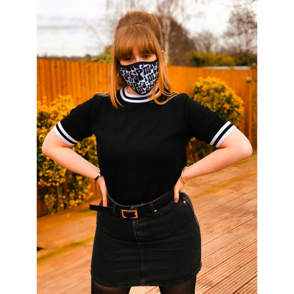 Women's version of Madcap England fabric face mask featuring retro 60s Madcap lettering black on white