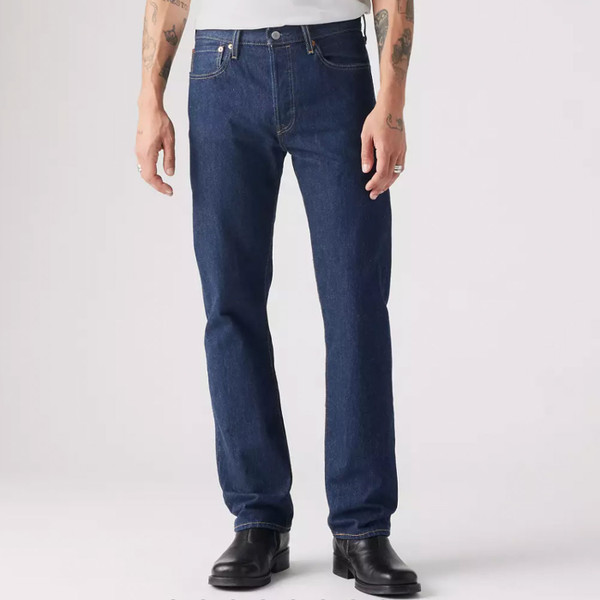 Man wears Levi's 501 Original Straight Leg Denim Jeans in One Wash Blue