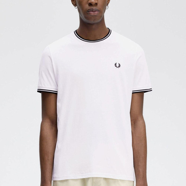 Man wearing Fred Perry Men's Mod Tipped T-Shirt in White with Black Tipping M1588 100 Man wearing Fred Perry Men's Mod Tipped T-Shirt in White with Black Tipping M1588 100