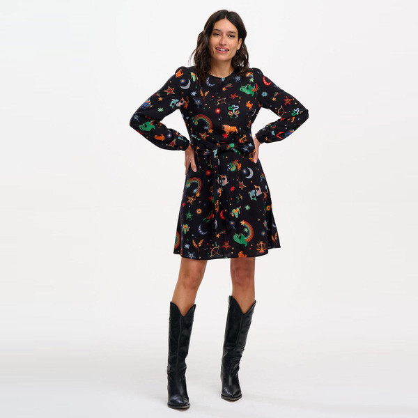 Model wearing Sugarhill Brighton Oksana Zodiac Print Mini Dress in Black D1188