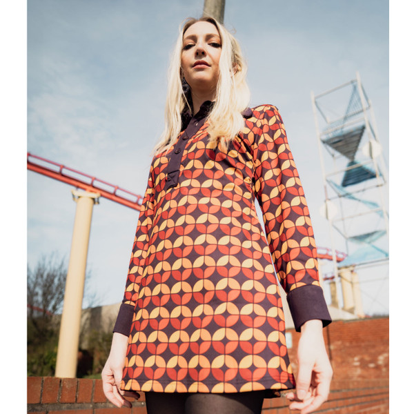 Woman wearing madcap england womens daydream 70s circle print long sleeve dress dark purple red orange