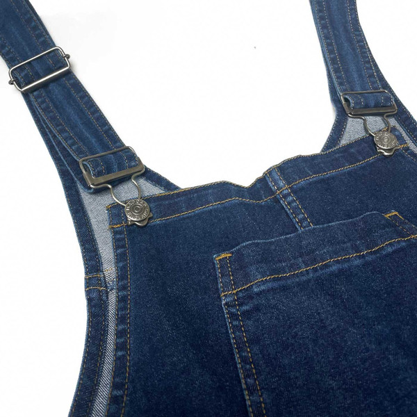 Rivet hook fastening and straps on Madcap England Womens Retro 70s Denim Dungaree Flares in Indigo Blue