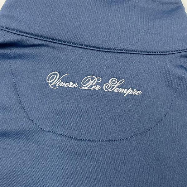 Close up on Vivere Per Sempre embroidery on Ellesse mens Riminali Live Forever 90s zip track top navy	