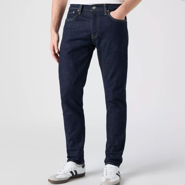 Man wears Levi's 512 Mens Slim Tapered Denim Jeans in Rock Cod Dark Blue Indigo