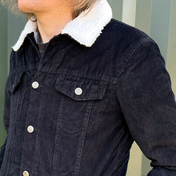 Collar details on Madcap England Woburn Sherpa Lined Trucker Jacket in Black