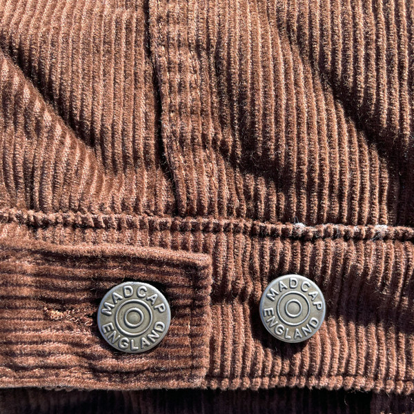 Button and tab adjusters on Madcap England Woburn Sherpa Collar Western Trucker Jacket in Cocoa