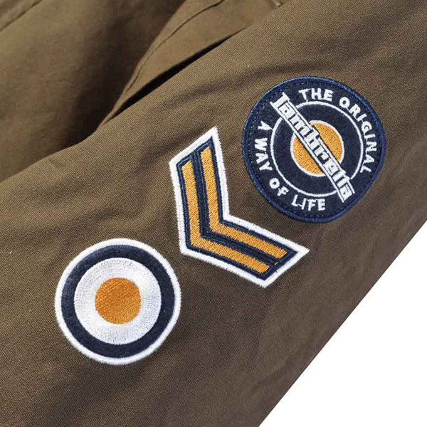 Patches on sleeve of Lambretta Sherpa Lined Mod Fishtail Parka Coat in Khaki SS6252
