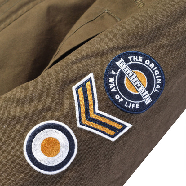 Sew on patches on sleeve of Lambretta Mod Sherpa Lined Hooded Fishtail Parka in Khaki Green
