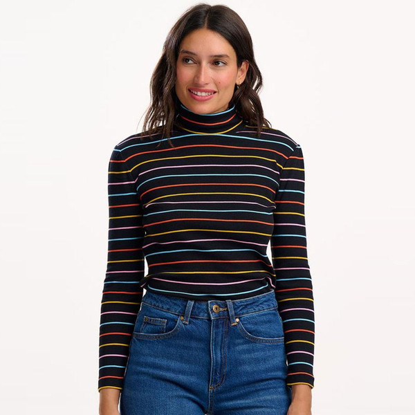 Model wears Sugarhill Brighton Emmy Turtleneck Rib Top in Black with rainbow stripe T0974