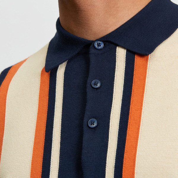 Ben Sherman 1960s Mod Vertical Stripe Knitted Polo Shirt in Dark Navy 1013023 025 Close up on fabric.