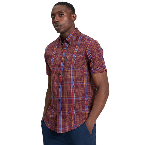 Picture of model wearing Ben Sherman Men's Mod Linear Check Short Sleeve Button Down Shirt in Dark Wine taken from side