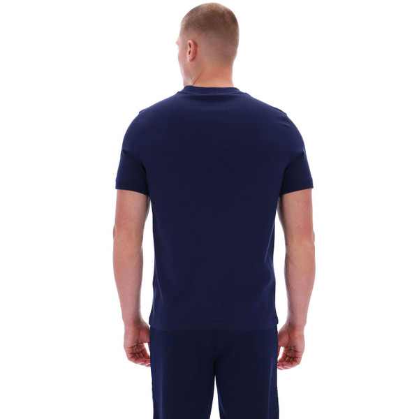 Picture of model wearing the Sergio Tacchini Master Retro 80s Chest Stripe T-shirt in Maritime Blue taken from back