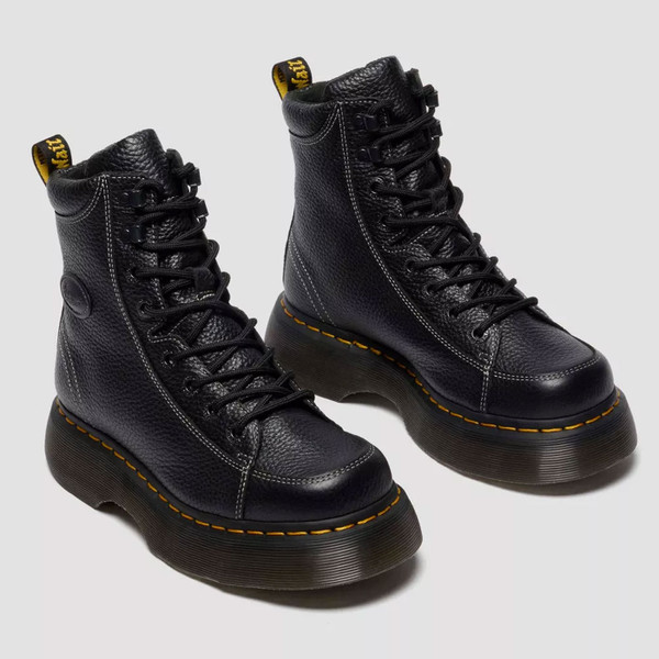 Both boots of Dr Martens Women's Buzz 8-Eye Milled Nappa Leather Boots in Black