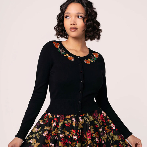 Model wears Hell Bunny Chester Autumnal Embroidered 50s Style Cardigan in Black