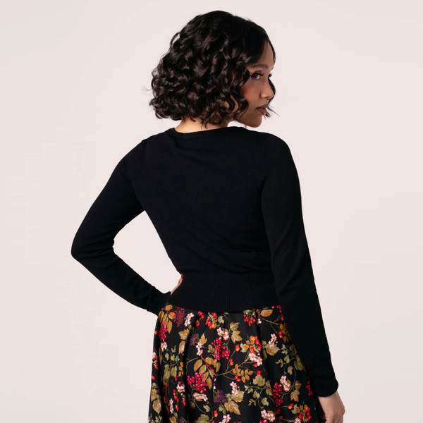 Back of woman wearing Hell Bunny Chester Autumnal Embroidered 50s Style Cardigan in Black