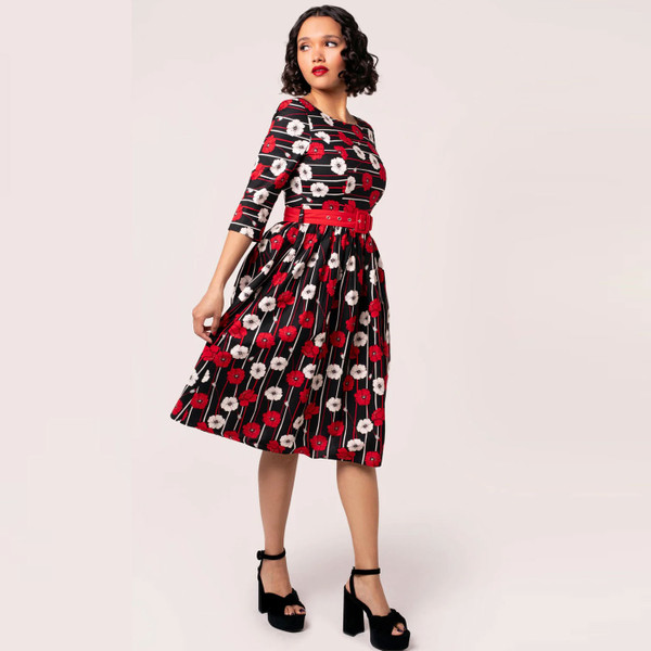 Side view of Hell Bunny Poppy Half length sleeve 50s dress with Remembrance Day Poppy print on black