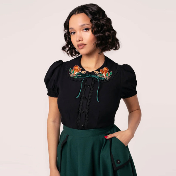 Model wearing Hell Bunny Chester womens black button up blouse with Autumnal Squirrel Embroidery