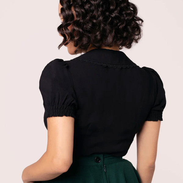 Back of woman wearing Hell Bunny Chester womens black button up blouse with Autumnal Squirrel Embroidery