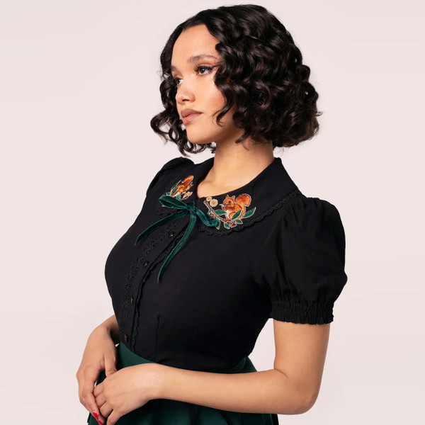 Side view of Hell Bunny Chester womens black button up blouse with Autumnal Squirrel Embroidery
