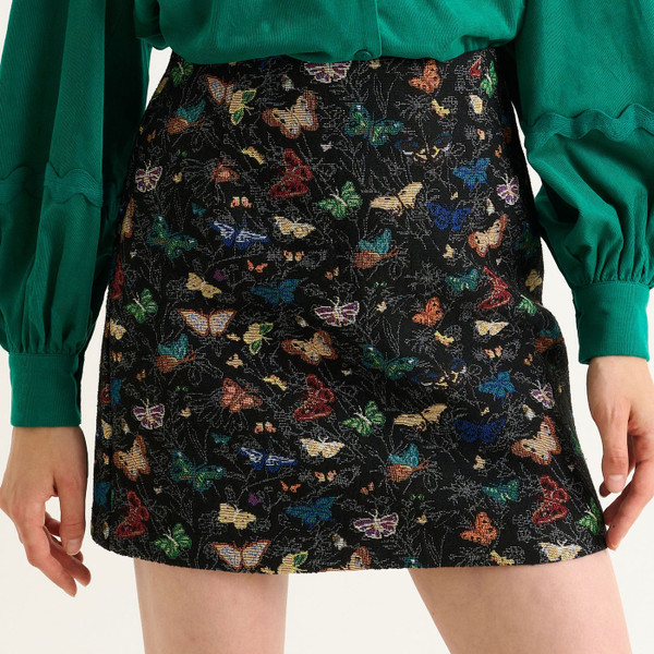 Close up of Louche London Aubin Butterfly Ball Mini A-Line Skirt in Black 60018