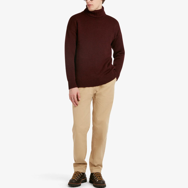 Man wearing Gloverall Submariner Merino Wool Roll Neck Jumper in Burgundy