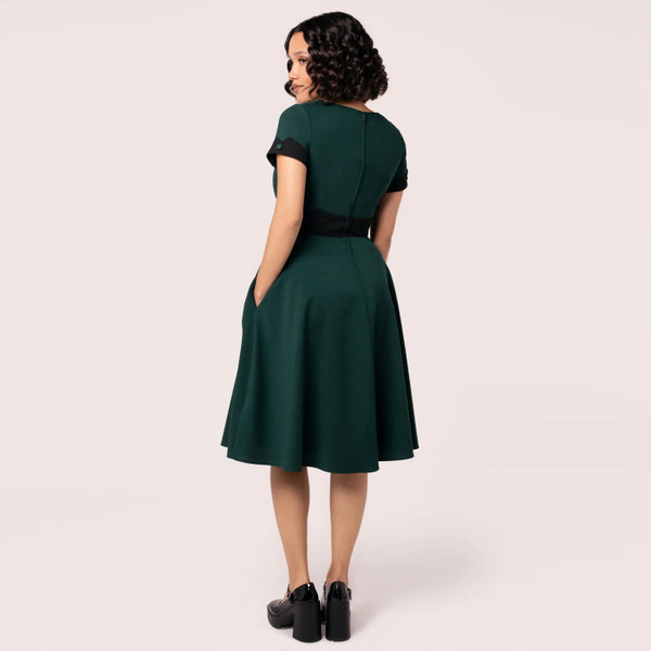 Back of woman wearing Hell Bunny Jessica Vintage Retro 50s Flared Short Sleeve Dress in Green