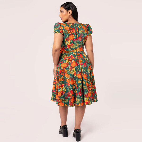 Back view of woman wearing Hell Bunny Pumpkin Patch Retro Flared Autumn Print Dress