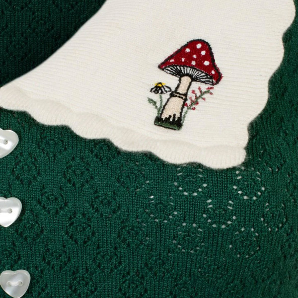 Close up of toadstool on Hell Bunny Genevieve Retro Autumn Toadstool Collar Top in Green