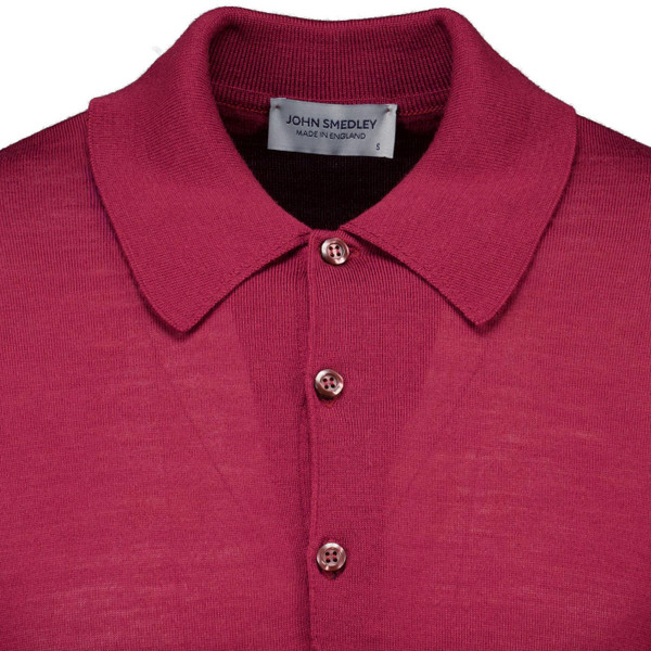 John Smedley Dorset 60s Mod Merino Wool Knit Polo Shirt in Woolf Red close up on fabric and collar