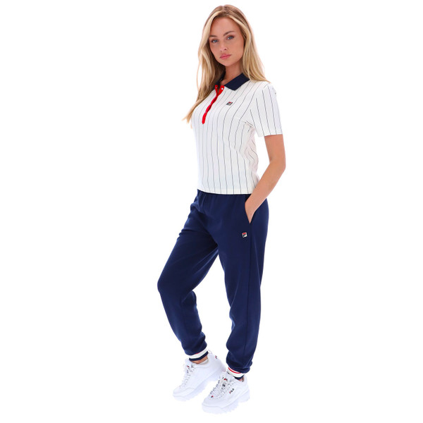 Side view of Fila Vintage women's Bai Pinstripe Tennis Polo Shirt in  Gardenia FW25WC010 130